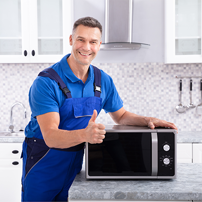 Happy Technician Holding The Microwave — Appliance Services Repair in Singapore