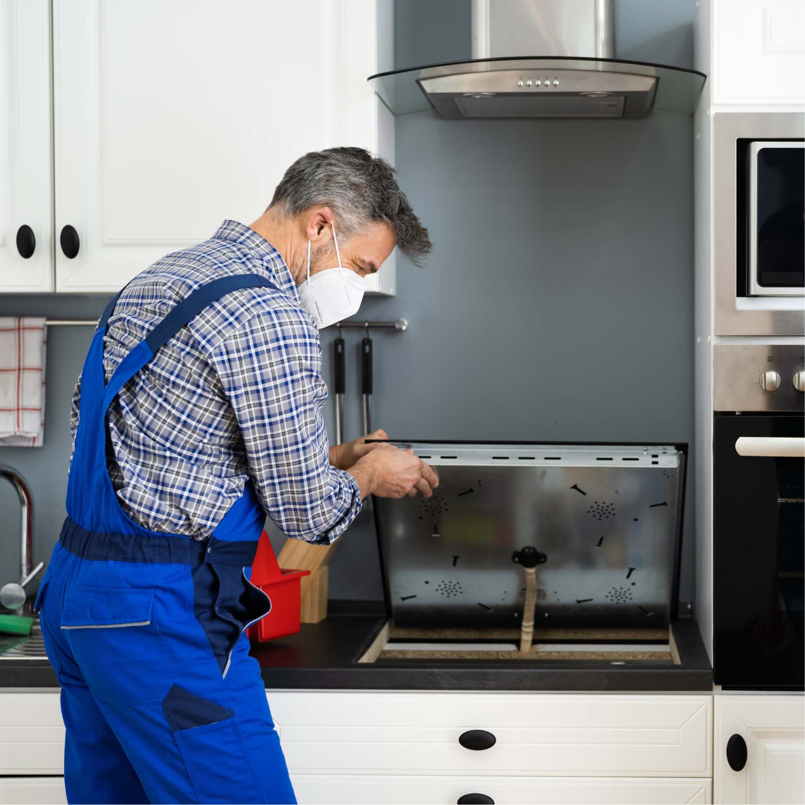 Technician Checking Gas Stove — Appliance Services Repair in Singapore