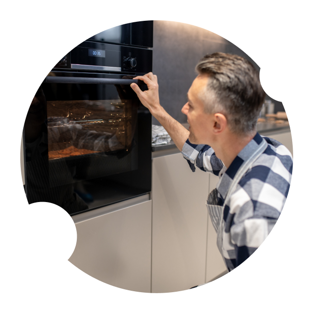 Man Checking the Oven — Appliance Services Repair in Singapore