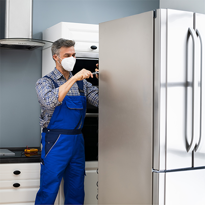 Technician Open the back Area of the Refrigerator — Appliance Services Repair in Singapore