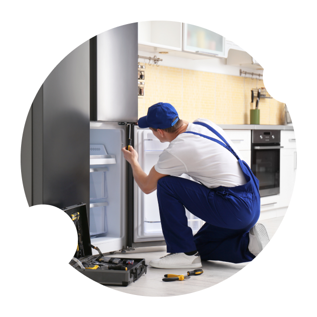 Technician Repairing The Fridge — Appliance Services Repair in Singapore